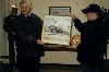 Don Laisure (right) presents memorabilia to Bill Kemball for museum