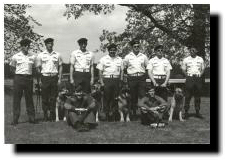 K-9 Demo Team: Back Row L to R - Sgt Wilson (NCOIC), Pasco, Sheers, Salinaz, Unk, Unk, Sgt Thornburg (Trng NCO). Bottom Row L to R - Reed & Elliott